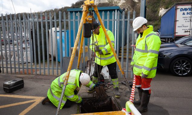 3 Willow engineers lifting a sewage pump to service it